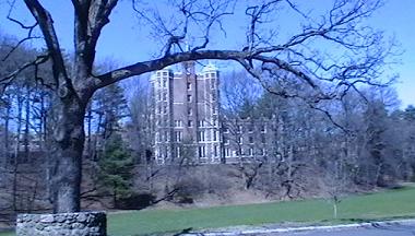 Wellesley College building framed by trees